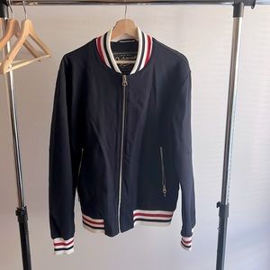 This is a Zara Men’s Navy Blue Track Jacket. Worn Twice. Like new condition.